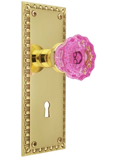 Ovolo Mortise-Lock Set with Colored Fluted Crystal Glass Knobs with Pink Colored Crystal Knob in Polished Brass.